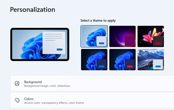 This image shows the Windows 11 Personalization settings menu, featuring a section titled 'Select a theme to apply' with six different visual theme options, alongside settings for 'Background' and 'Colors'.